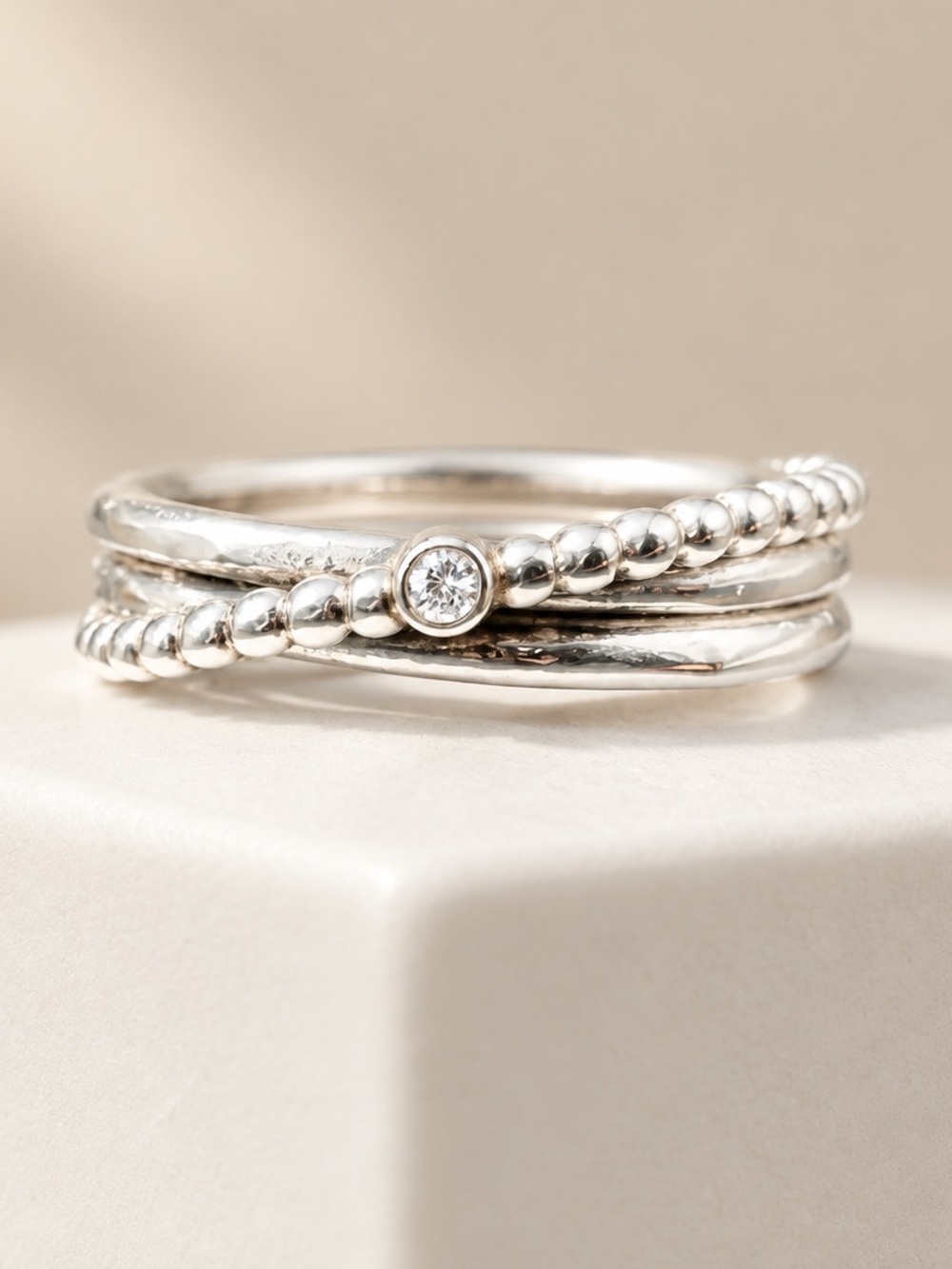 Sterling Silver Stackable Beaded and Twisted Ring with a diamond set in gold